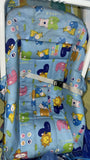 Children's seat with cartoon animal patterns on a blue background