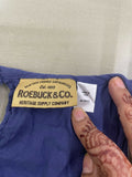 Roebuck & Co. label on a blue garment with a hand pointing to it.