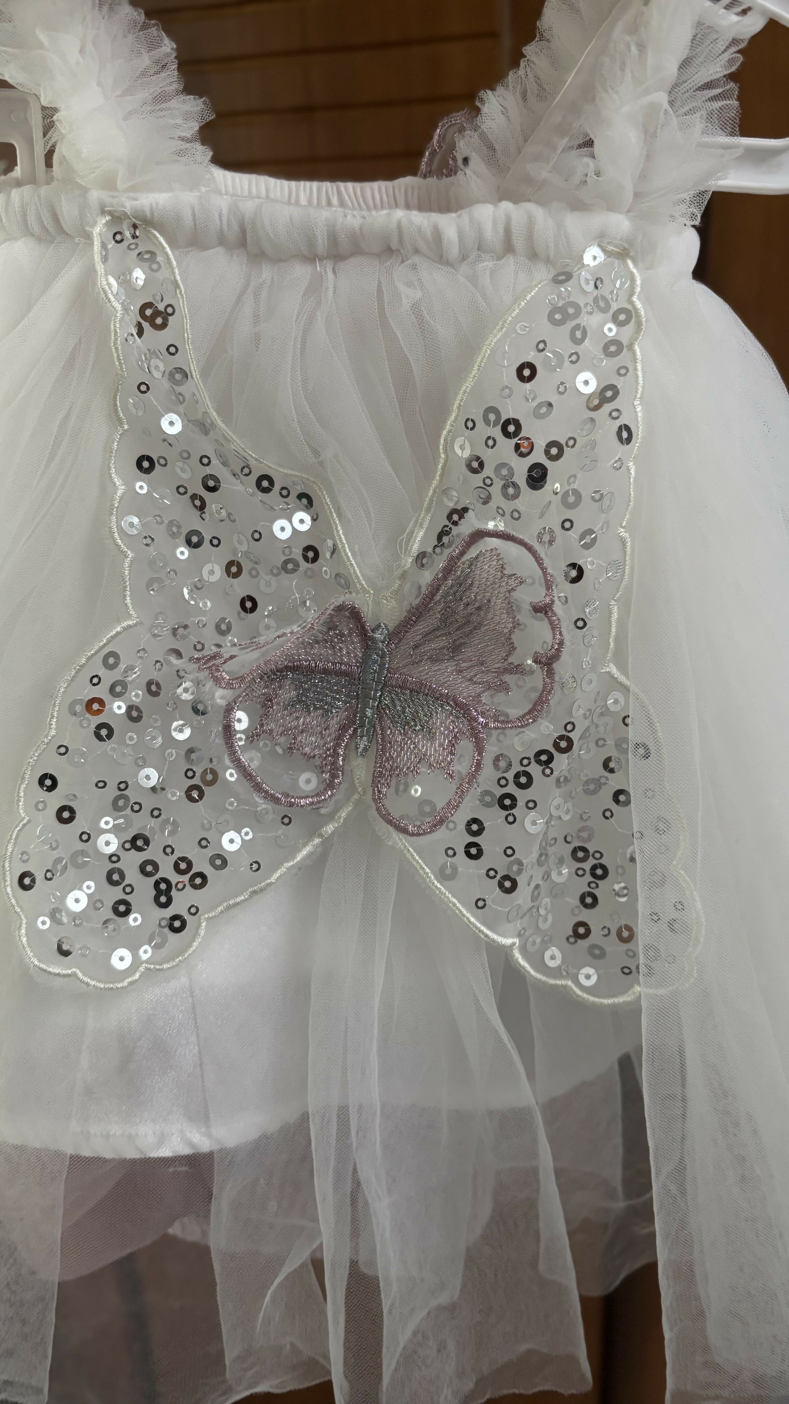White dress with butterfly wings and sequins