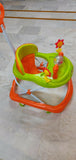 Colorful baby walker on a tiled floor