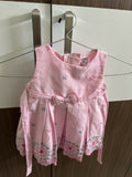 Pink children's dress with floral embroidery