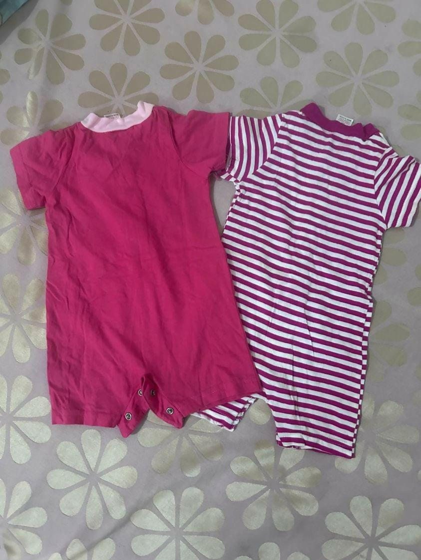 Set of 2 Rompers for baby girls, featuring soft, breathable fabric and easy snap closures for comfort and convenience.