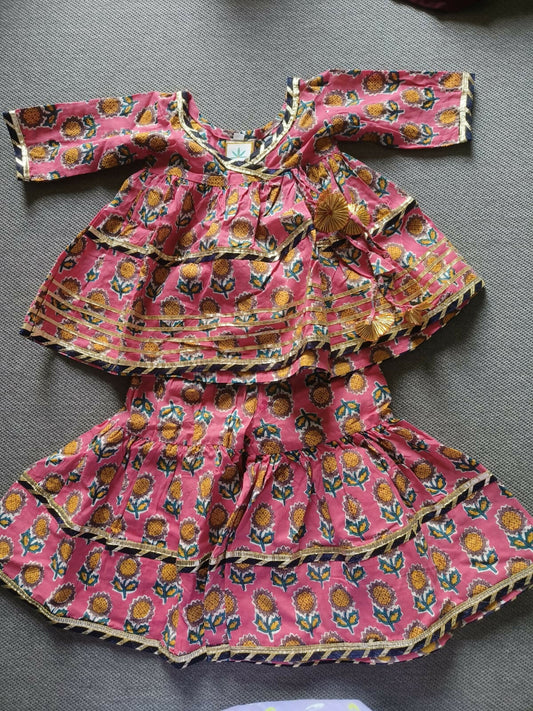 Enhance your baby girl's festive wardrobe with the TEENTARE Kurta and Sharara Set – a charming and comfortable outfit perfect for special occasions, featuring vibrant colors and intricate designs.