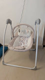 R for Rabbit automatic electric swing with gentle rocking motion, cushioned seat, secure safety harness, soothing comfort, and relaxing support for babies.