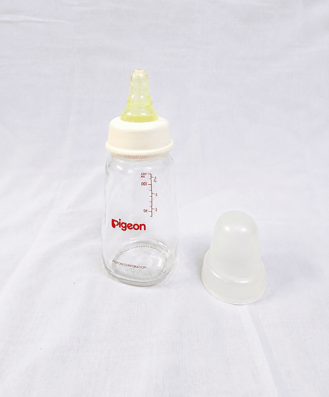 Pigeon 120ml Glass Feeding Bottle with Peristaltic silicone nipple, BPA-free glass, ergonomic shape, and durable design for safe, comfortable, and natural feeding for newborns and infants.