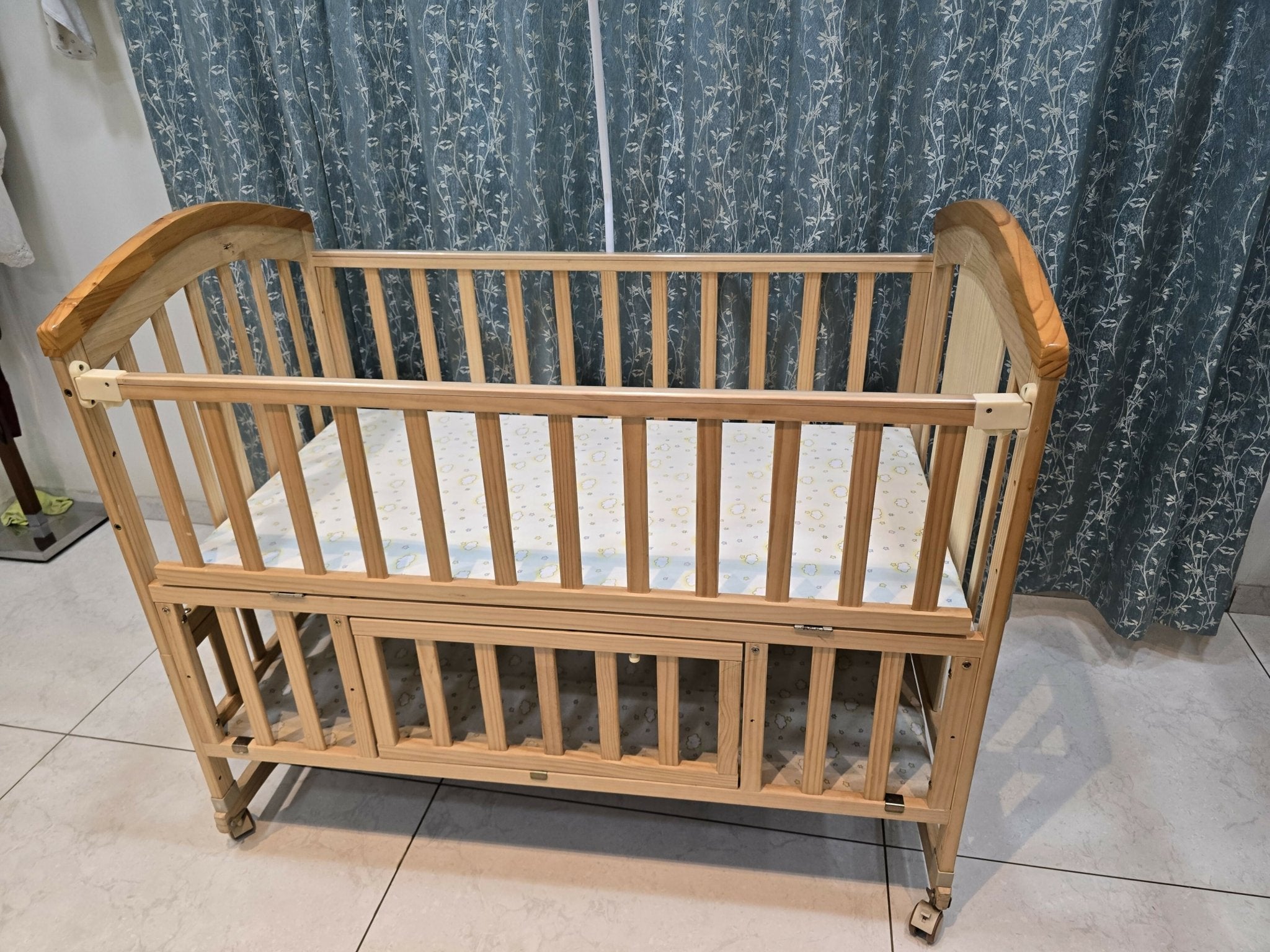 BabyTeddy® 16-in-1 original patented baby crib with convertible cot, toddler bed, cradle rocker, study desk, kids' sofa mode, mosquito net, soft mattress, and diaper changing station for newborns and growing children.
