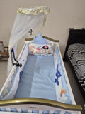 HUNYHUNY 15 in 1 Baby Crib/Rocker in Almost New condition featuring a versatile convertible design, rocking function, protective side rails and spacious sleeping area designed to adapt to different stages of your child’s growth.