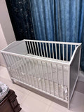 IKEA Baby Cot measuring 60 × 120 cm (23 5/8 × 47 1/4 inches), featuring a simple, practical design with protective side rails and a spacious sleeping area for babies.