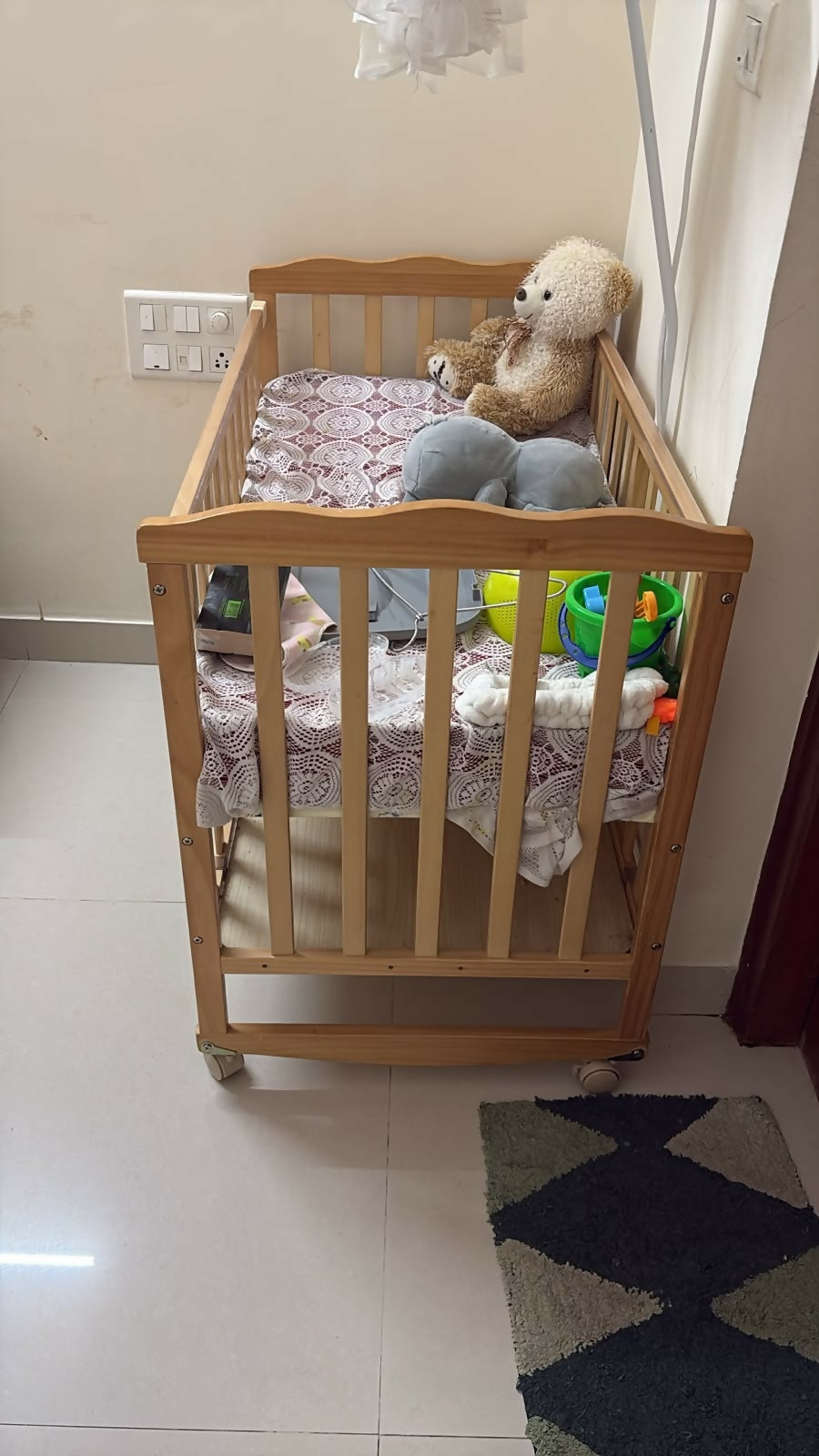 BABYHUG Montana Cot/Crib with Mattress featuring a sturdy design, protective side rails and comfortable mattress, creating a practical and cozy sleeping space for babies at home.