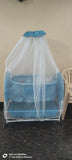 Baby jhula in blue with mosquito net and storage basket, featuring a gentle rocking design, cozy sleeping space, protective net, and convenient storage for baby essentials.
