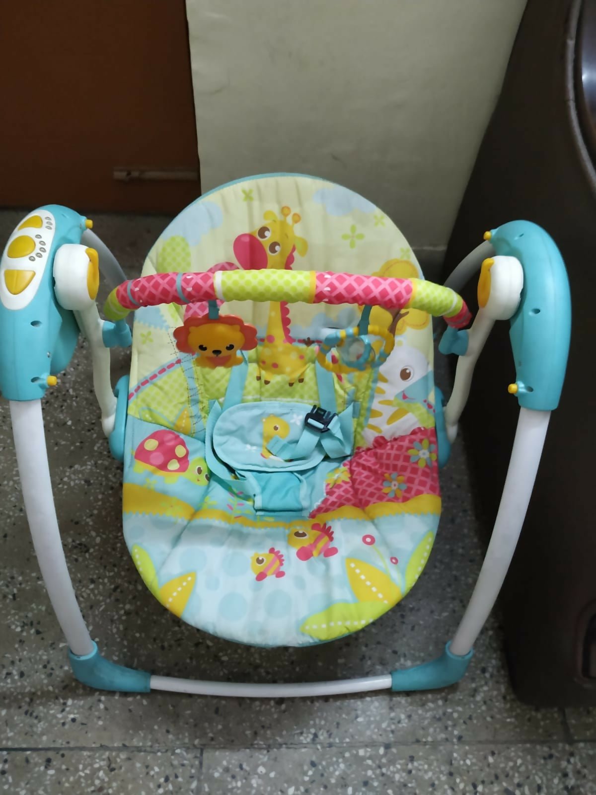 Mastela Deluxe Portable Swing Aqua with a comfortable cushioned seat, soothing swing motion, secure safety harness, compact foldable design, and calming features for babies.