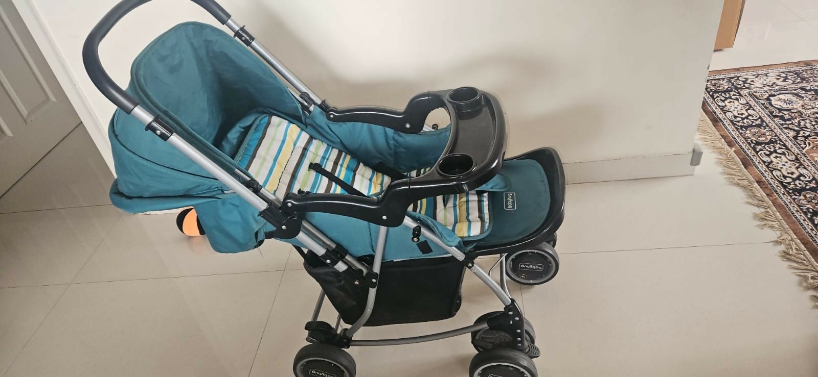 BABYHUG 2-in-1 Rock & Roll Stroller/Pram Cum Rocker with a convertible stroller and rocker design, reclining seat, reversible handle, adjustable canopy, 5-point safety harness, and foldable frame for versatile everyday use.