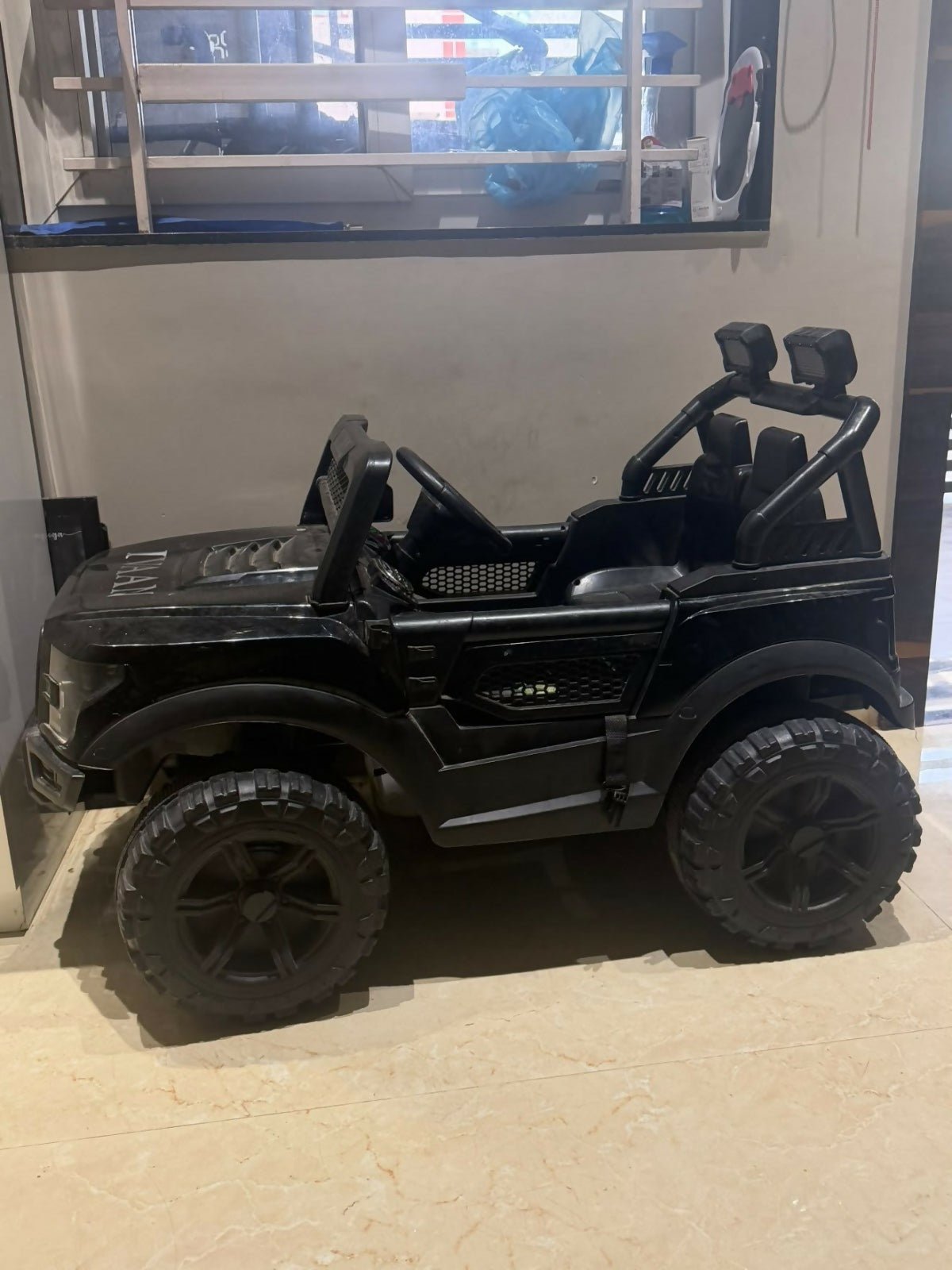 Battery Jeep for Kids with realistic design, rechargeable battery, working headlights, music, sturdy wheels, and easy controls for fun indoor and outdoor rides for young children.