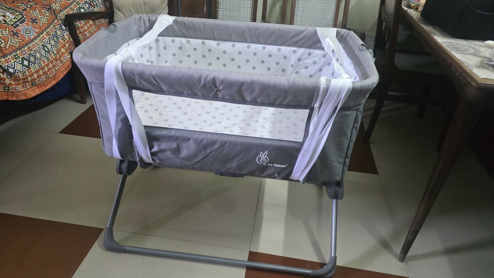 R for Rabbit Hop A Little baby cot bedside bassinet with sturdy frame, breathable sides, adjustable height, and a cozy sleeping space for newborns and infants.