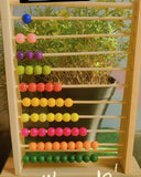 CHANNAPATNA wooden abacus toy with colorful beads and traditional handcrafted wooden construction, designed to encourage early counting, number recognition, color learning, hand-eye coordination, and fine motor skills.