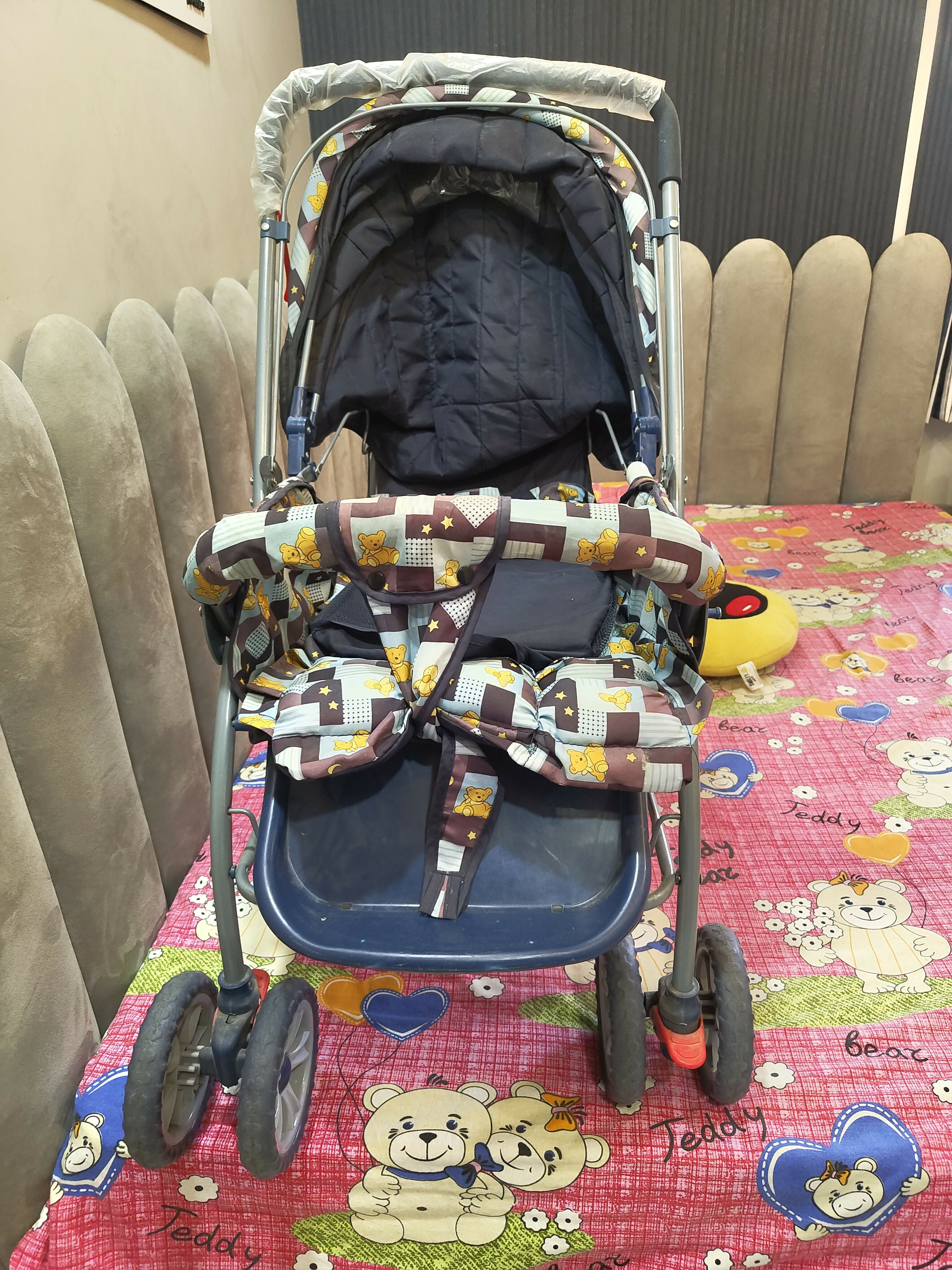 Baby stroller with patterned canopy with cartoon designs