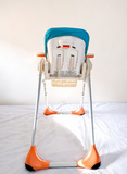 Chicco Polly foldable baby high chair with reclining feeding seat, adjustable tray, cushioned seating, sturdy frame, and premium design for comfortable baby mealtime and feeding.