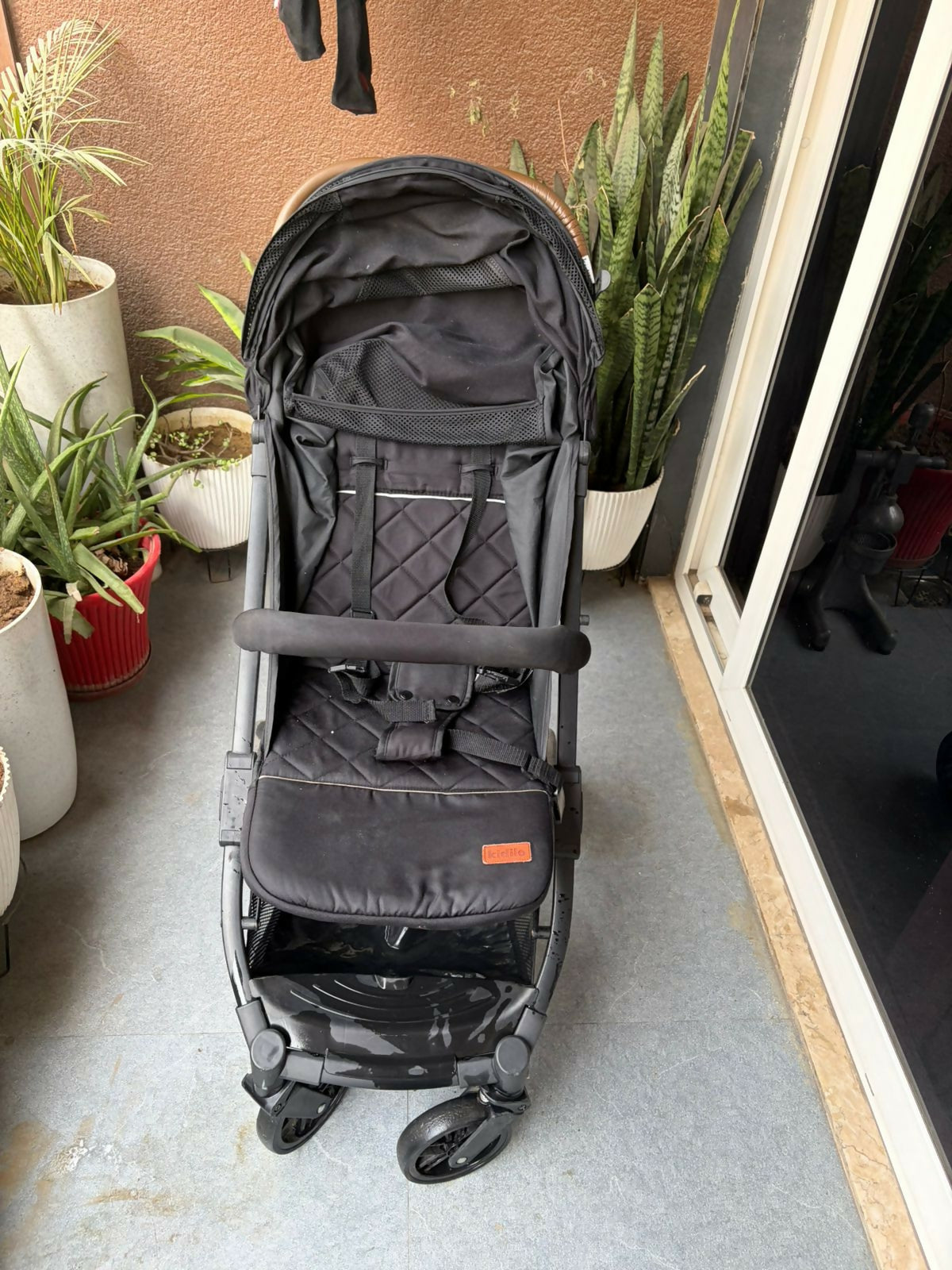 KIDILO one-click foldable baby stroller with compact folding design, reclining seat, sturdy wheels, safety harness, and 20 kg weight capacity for comfortable baby travel.