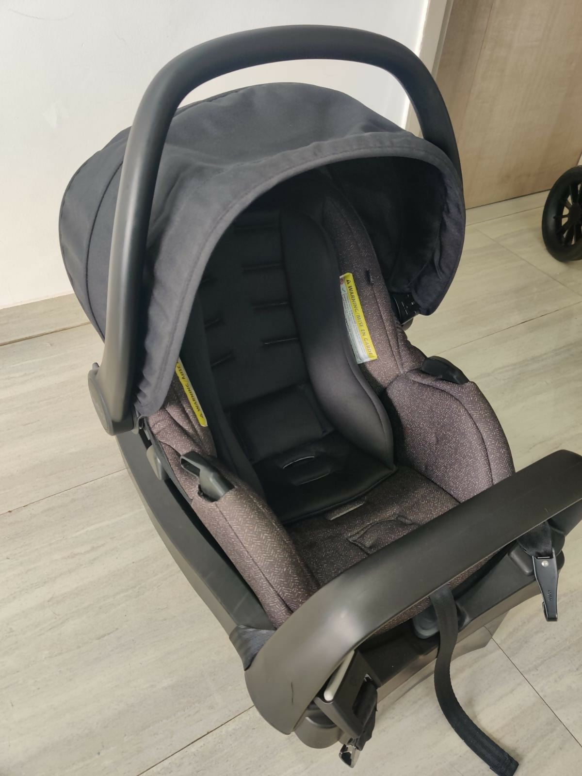 Evenflo travel system with baby stroller and infant car seat, featuring a foldable design, reclining seat, adjustable canopy, 5-point safety harness, and spacious storage basket for convenient travel.