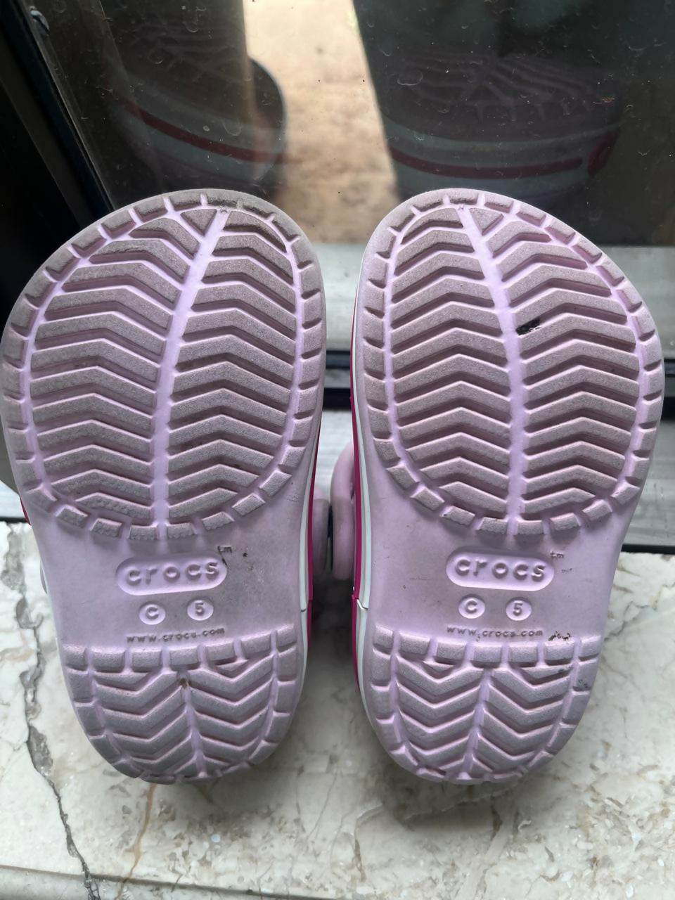 Pink Crocs for Kids in size C5 / 5.1 inches, featuring a lightweight, comfortable and easy-to-wear clog design with ventilation holes for everyday casual wear, playtime and outings.