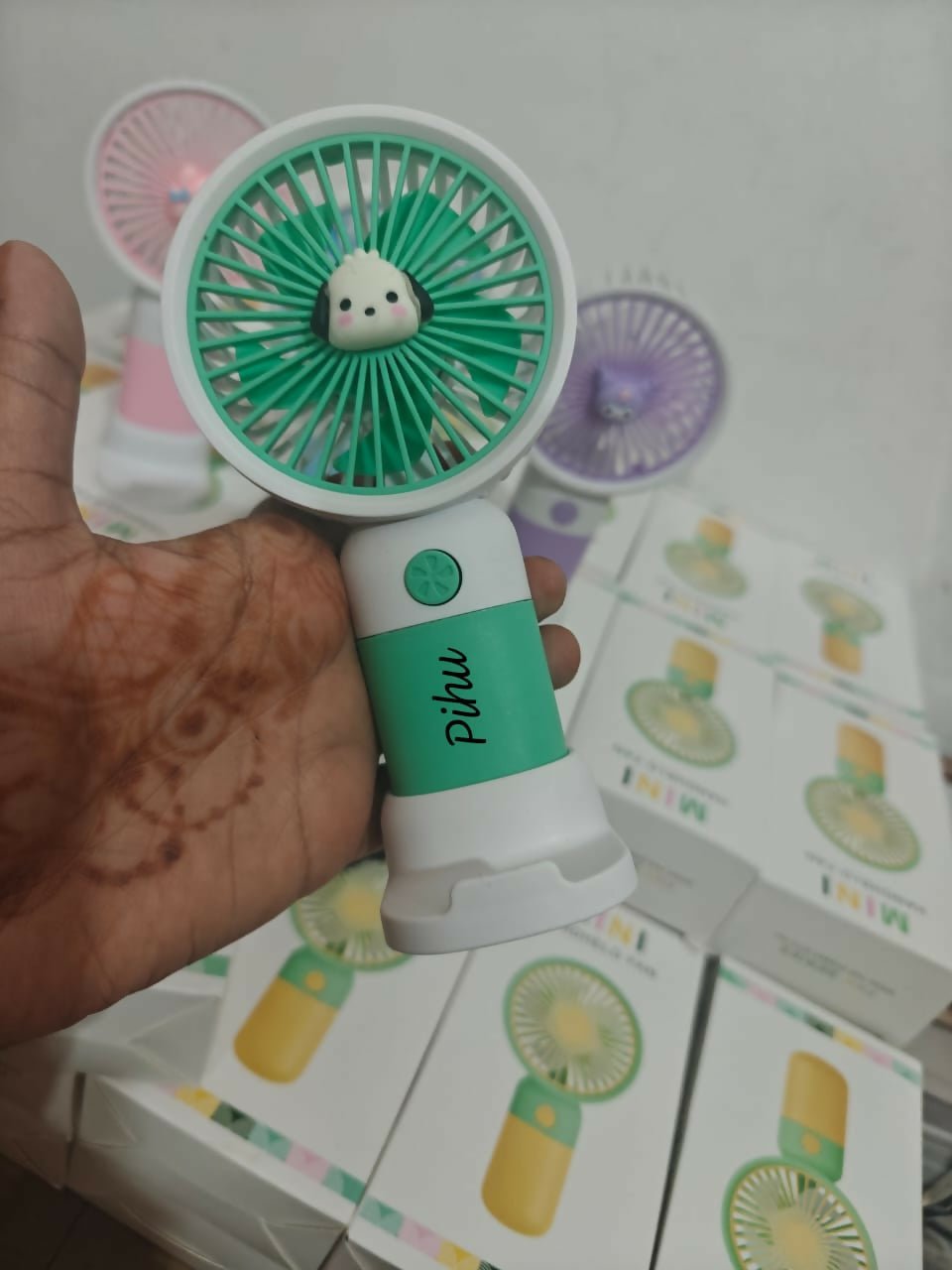 Personalized portable fan with stand and mobile holder featuring compact design, custom personalization, adjustable support, hands-free convenience, and cooling comfort for everyday use.