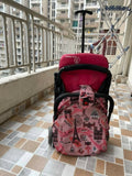 Pink baby stroller with Eiffel Tower design on a balcony