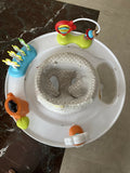 Skip Hop Play Gym with a soft padded play mat, hanging developmental toys, baby-safe mirror, and interactive activities to encourage tummy time, sensory exploration, and early development.