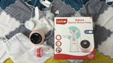Luvlap breast pump set with packaging on a patterned surface