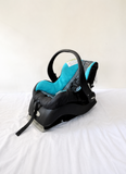 Evenflo Embrace infant car seat with base, rear-facing design, cushioned newborn support, secure safety harness, and portable baby carrier functionality for safe travel.