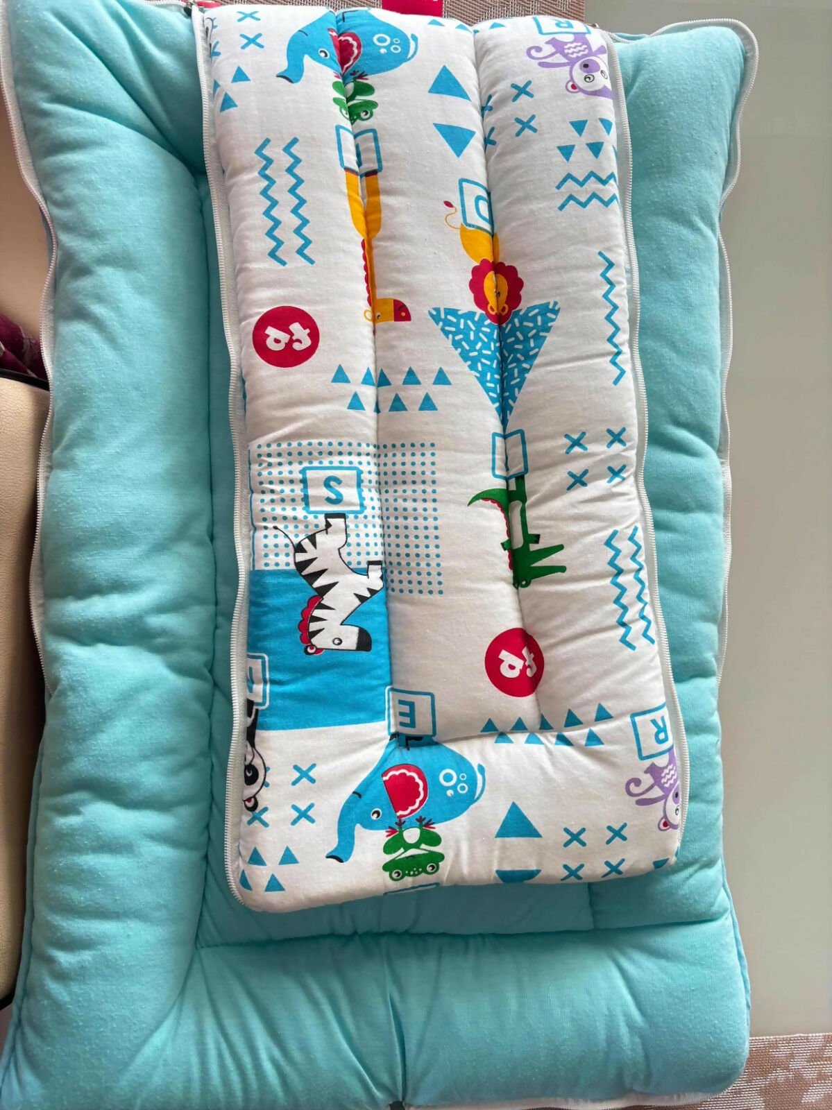 FISHER-PRICE blue sleeping bag with cute prints, soft comfortable fabric, cozy design, and snug warmth for babies during sleep, naps, and travel.