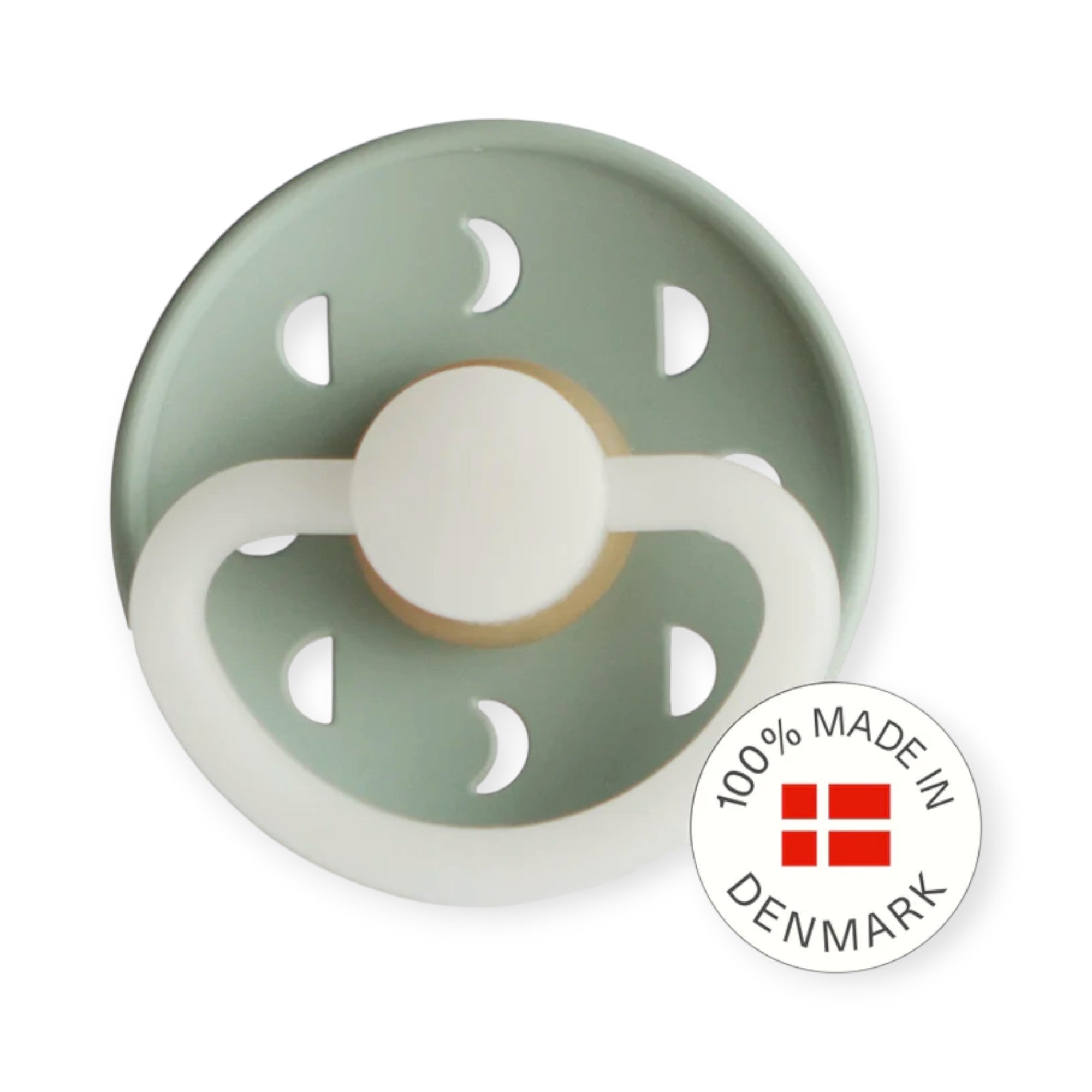 Green and white baby pacifier with 'Made in Denmark' label on a white background