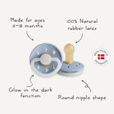 Two baby pacifiers with text describing features and a 'Made in Denmark' logo.