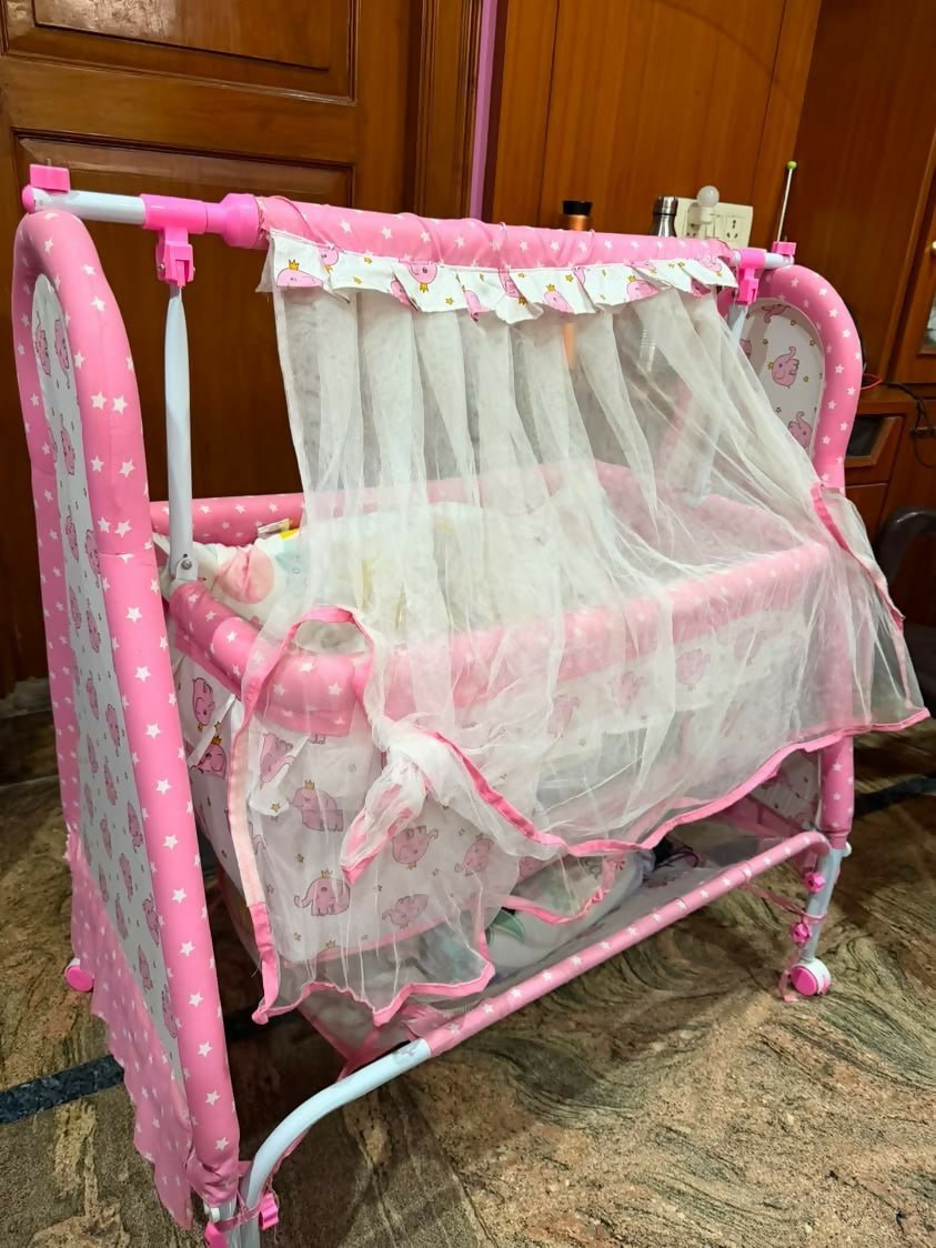Fab N Funky Manual Cradle with a sturdy frame, gentle manual rocking motion, comfortable sleeping area, breathable design, and secure construction to provide a cozy resting space for newborns and infants.