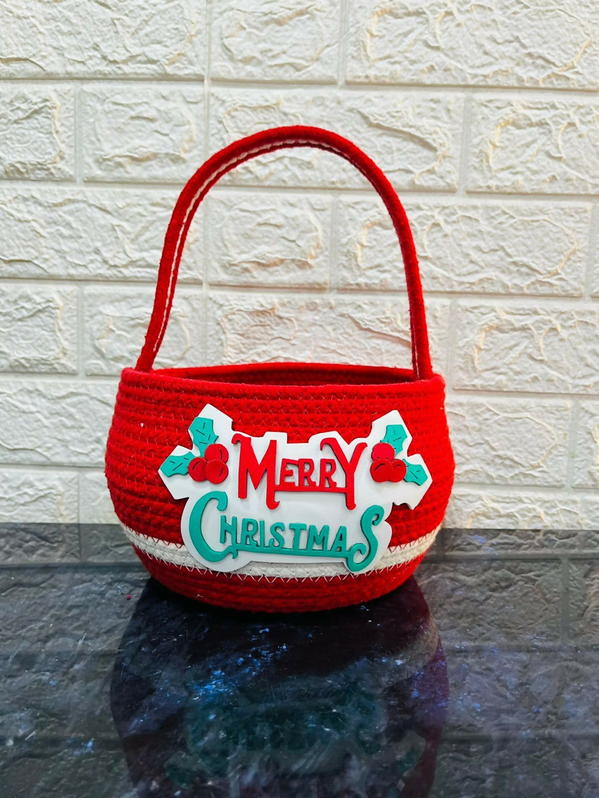 Red woven basket with 'Merry Christmas'