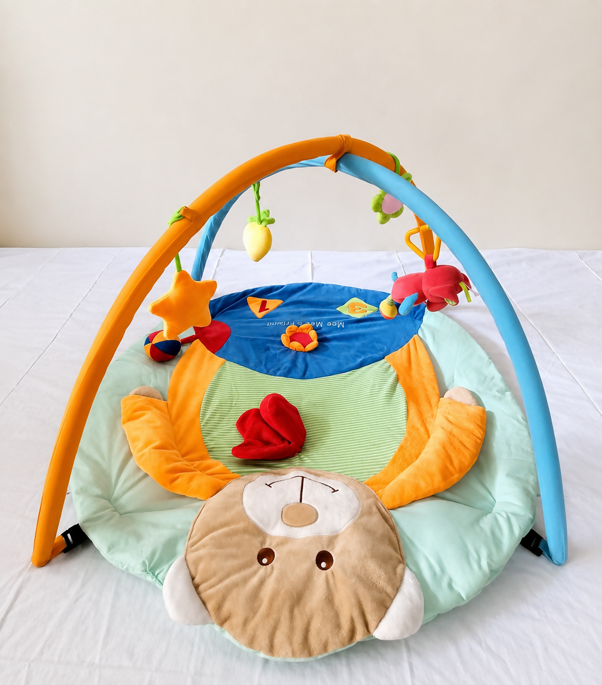 Mee Mee Baby Activity Play Gym Tummy Time Mat with hanging toys, soft cushioned mat, foldable design, and carry bag to encourage tummy time, sensory development, and motor skills.