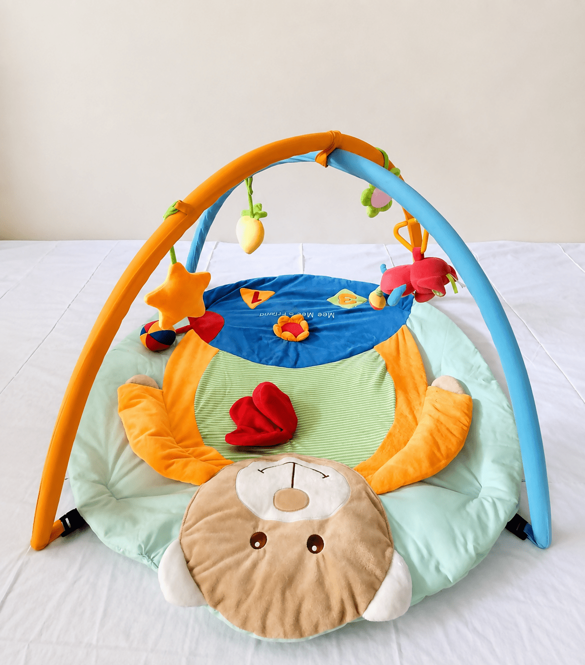 Mee Mee Baby Activity Play Gym Tummy Time Mat with hanging toys, soft cushioned mat, foldable design, and carry bag to encourage tummy time, sensory development, and motor skills.