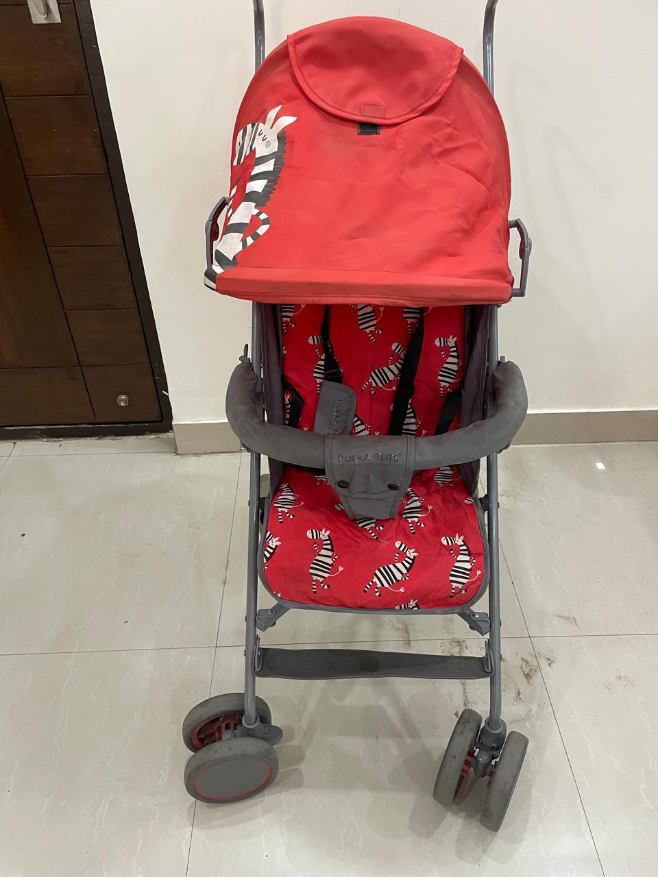POLKA TOTS baby stroller with 5-point safety harness, adjustable canopy, storage basket, lightweight umbrella-fold design, and smooth wheels for babies and toddlers up to 20 kg (0–5 years).
