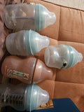 5 Tommie tippie bottle & 4 pacifier