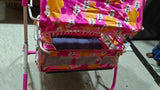 Cart with colorful fabric on a floor