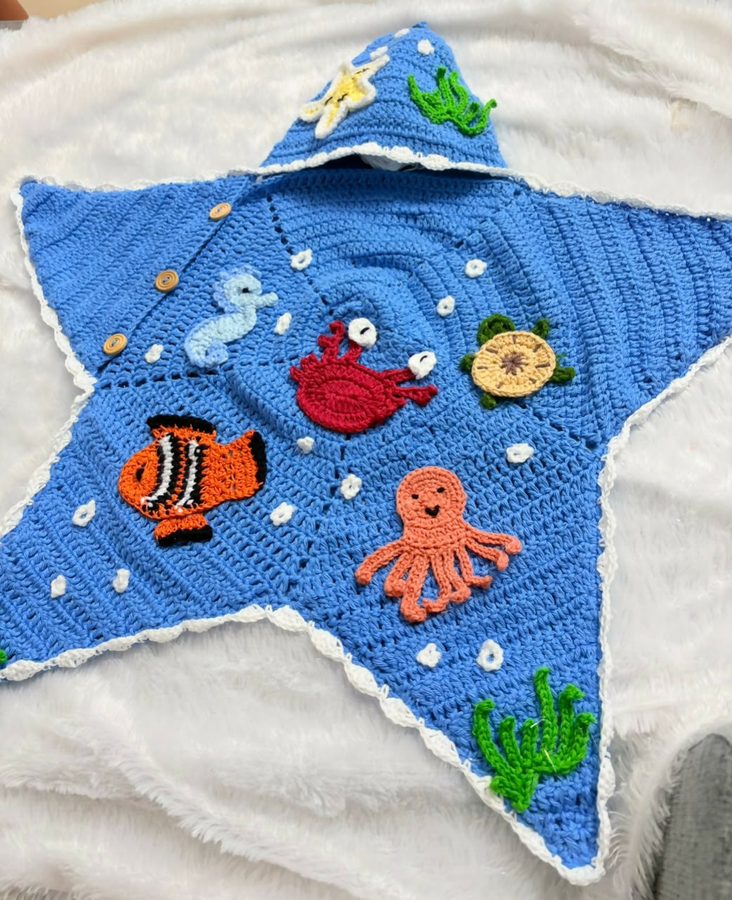 Handmade Crochet Baby Cocoon with Patches featuring a cozy handcrafted design, soft crochet texture, and charming decorative patches, ideal for newborn photoshoots, gifting, and supervised cozy moments.
