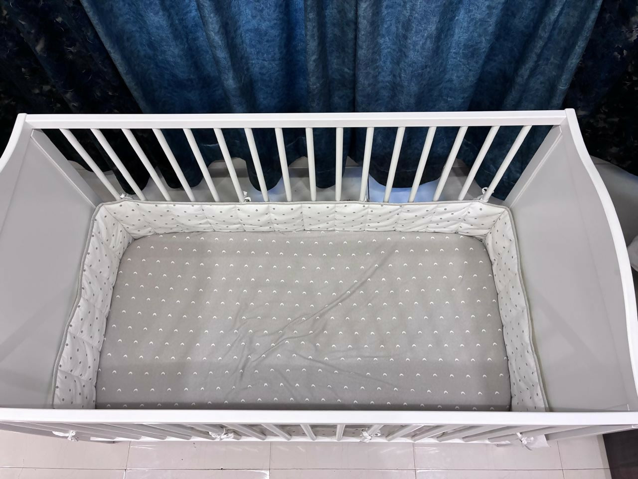 IKEA Baby Cot measuring 60 × 120 cm (23 5/8 × 47 1/4 inches), featuring a simple, practical design with protective side rails and a spacious sleeping area for babies.