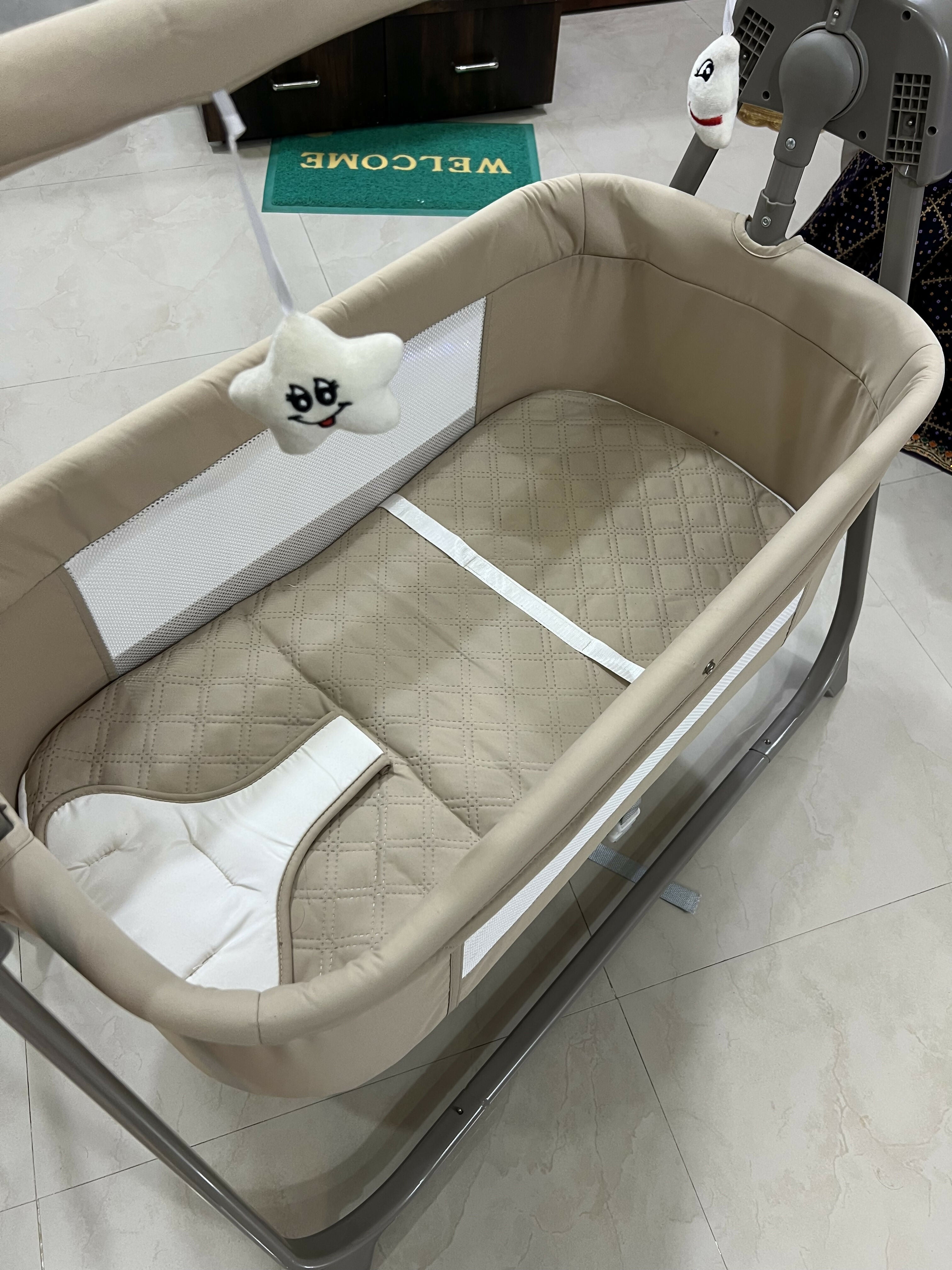 INFANTSO Premium Electric Baby Cradle Swing featuring an electric swinging function, comfortable resting space and supportive design for convenient supervised soothing, relaxing and everyday use with your baby.