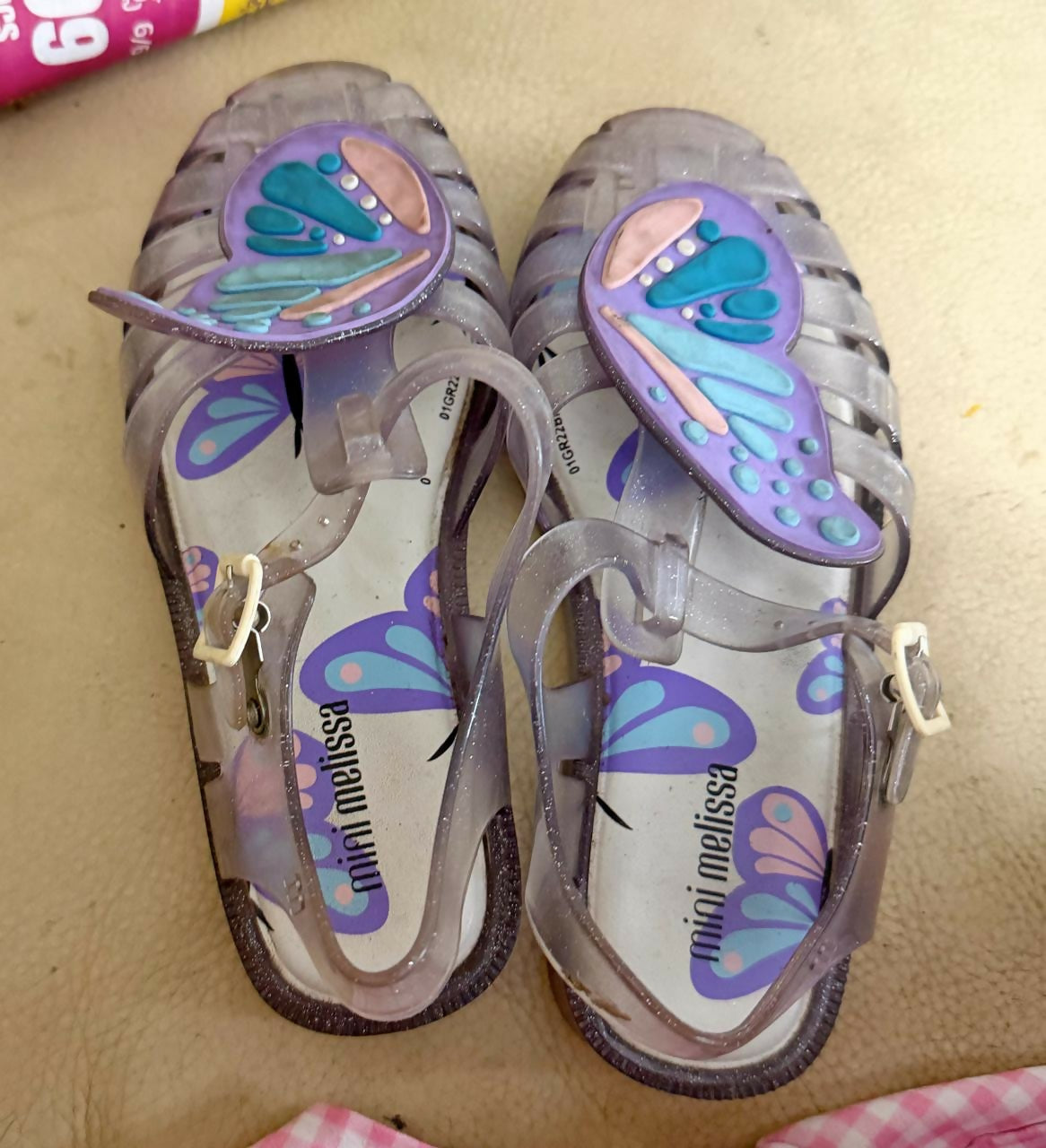 Pair of children's sandals with butterfly design