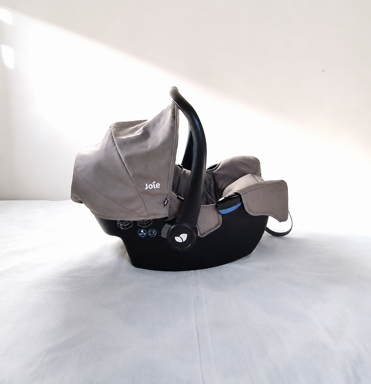 JOIE Gemm Infant Car Seat B134 in Almost New condition, rear-facing for newborns up to 13 kg, featuring a secure harness, comfortable padded seating, protective canopy, and convenient infant travel design.