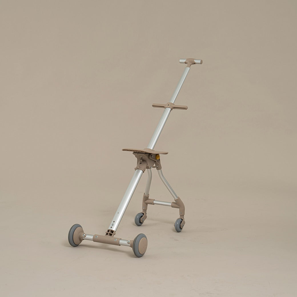 Three-wheeled scooter with a stand on a beige background