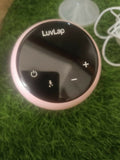 LUVLAP Adore electric breast pump with LUVLAP feeding bottle, adjustable suction settings, compact design, and convenient milk collection support for breastfeeding mothers.