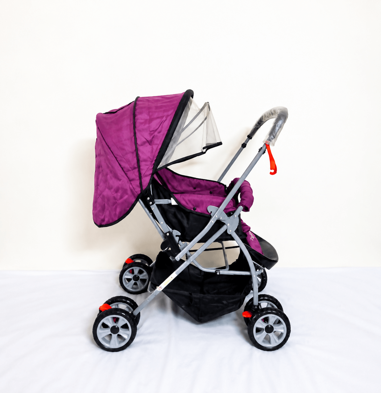 Tiffy & Toffee Maxtrem baby stroller with reversible handle, reclining seat, foldable travel pram design, adjustable canopy, 5-point safety harness, smooth wheels, and storage basket for babies and toddlers up to 22 kg.