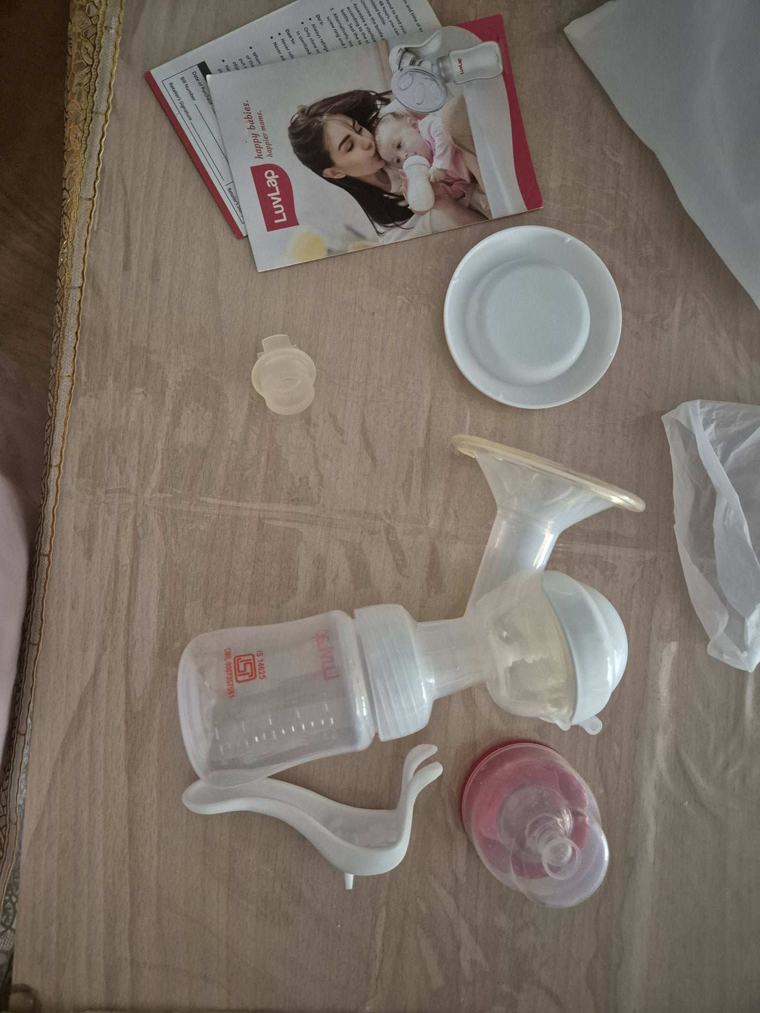 LuvLap manual breast pump with ergonomic handle, soft silicone cushion, BPA-free components, and a lightweight design for comfortable and efficient breast milk expression.