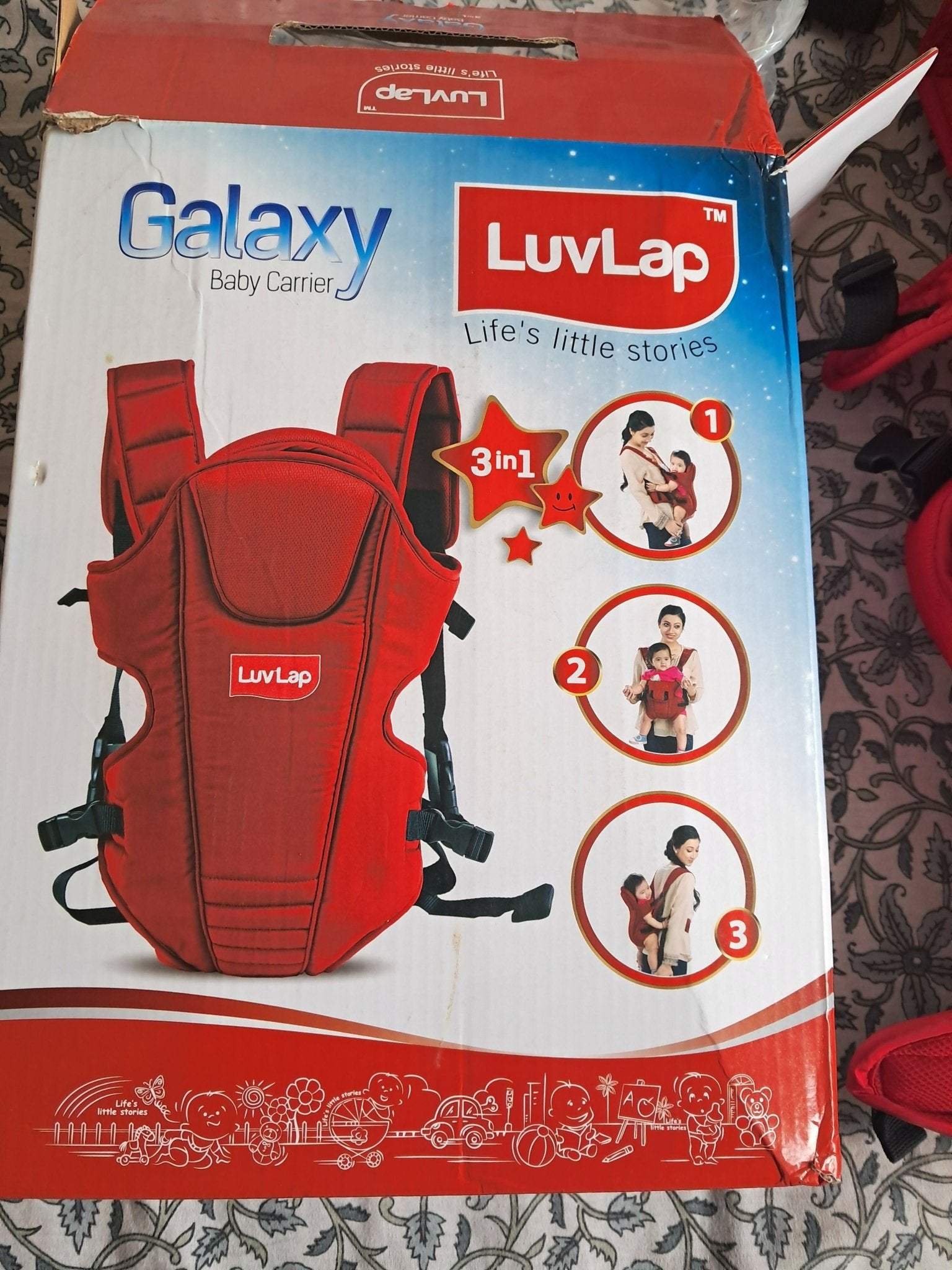 LuvLap Galaxy baby carrier in red with ergonomic support, adjustable straps, cushioned comfort, secure carrying design, and hands-free convenience for babies and parents.