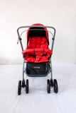 LuvLap Galaxy Baby Stroller Pram in Red & Black with reversible handle, reclining seat, adjustable canopy, safety harness, smooth wheels, foldable frame, and storage basket for comfortable baby travel.